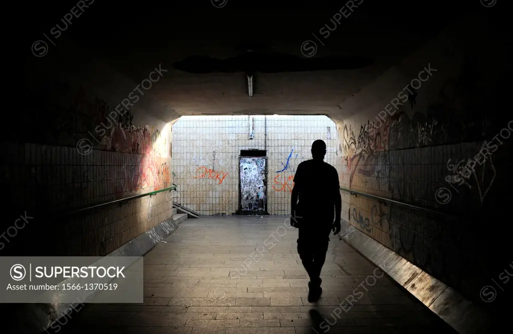 Man goes through a tunnel into the light
