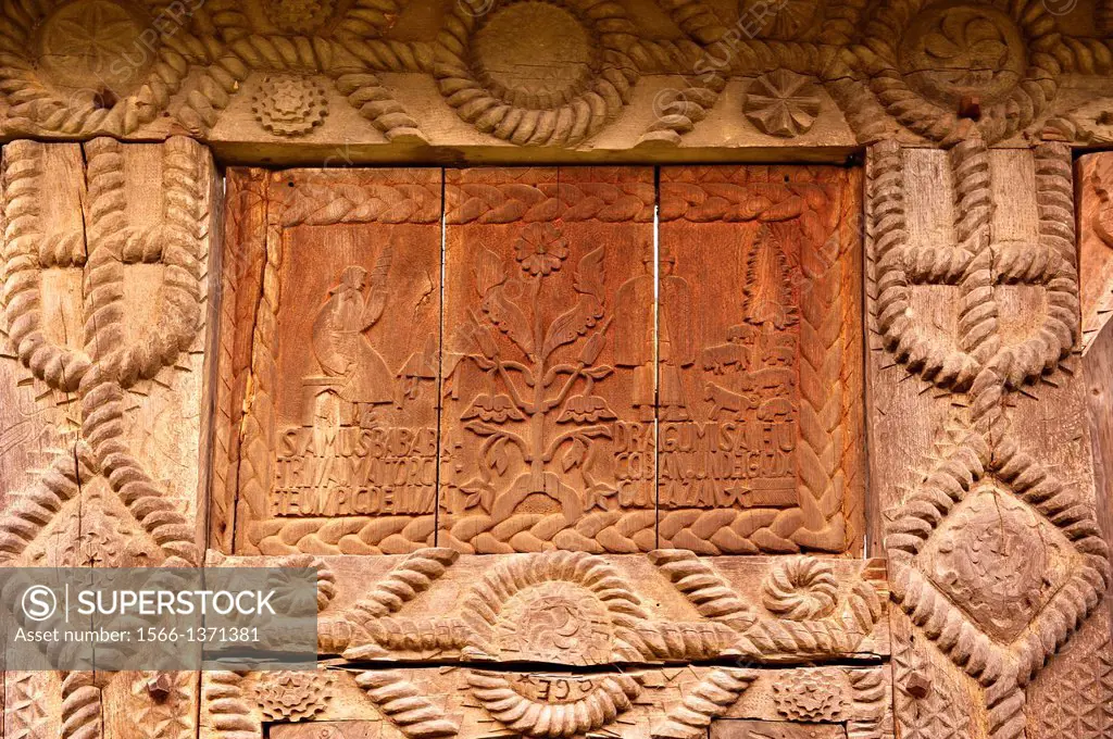 19th century traditional Iza Valley farm house carved wooden folk art gates, The Village museum near Sighlet, Maramures, Northern Transylvania.