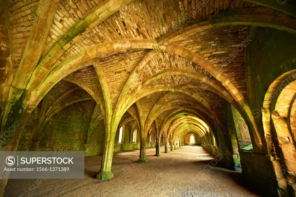 Gothic arches of the great hall of Fountains Abbey , founded in 1132, is one of the largest and best preserved ruined Cistercian monasteries in Englan...