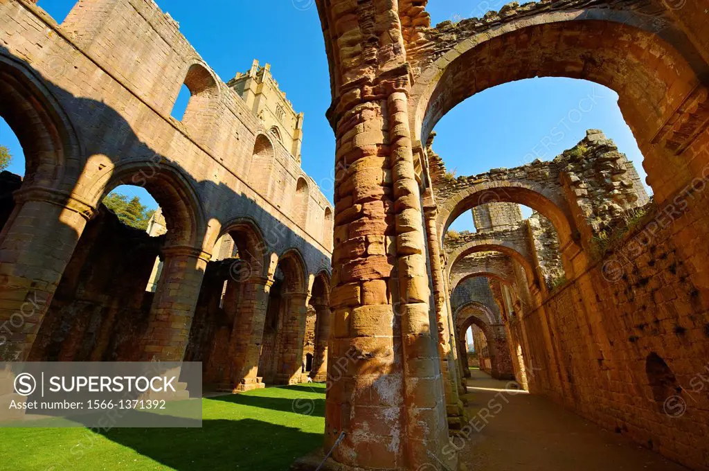 Main & side aisle of Fountains Abbey , founded in 1132, is one of the largest and best preserved ruined Cistercian monasteries in England. The ruined ...