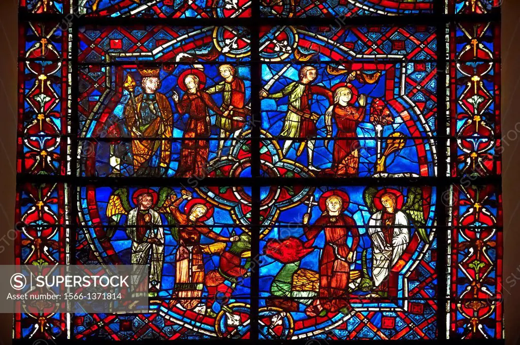 Medieval stained glass Window of the Gothic Cathedral of Chartres, France - dedicated to St Margret and St Catherine. Bottom left panel - St Margaret ...