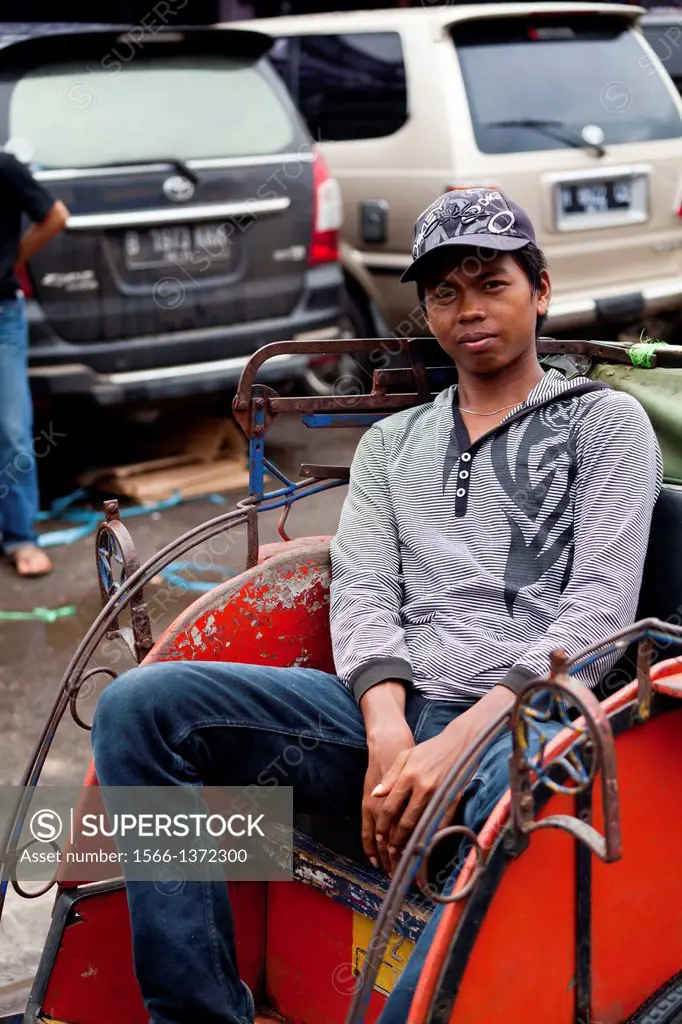 Rikshaw Driver in Banjarmasin, Indonesia.
