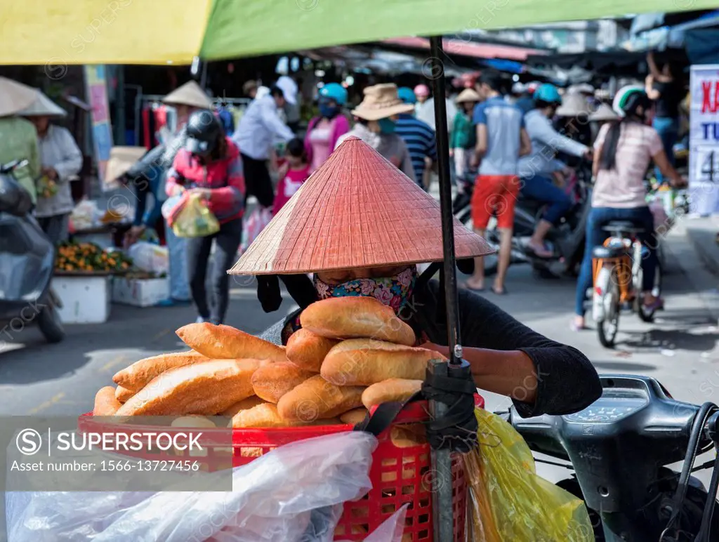 French bread vendor, Hoi An, Vietnam.
