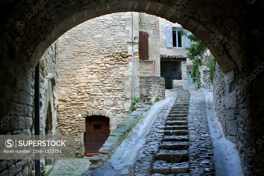 Typical paved street in Gordes village, labeled The Most Beautiful Villages of France, Vaucluse department, Provence-Alpes-Cote d´Azur region. France.