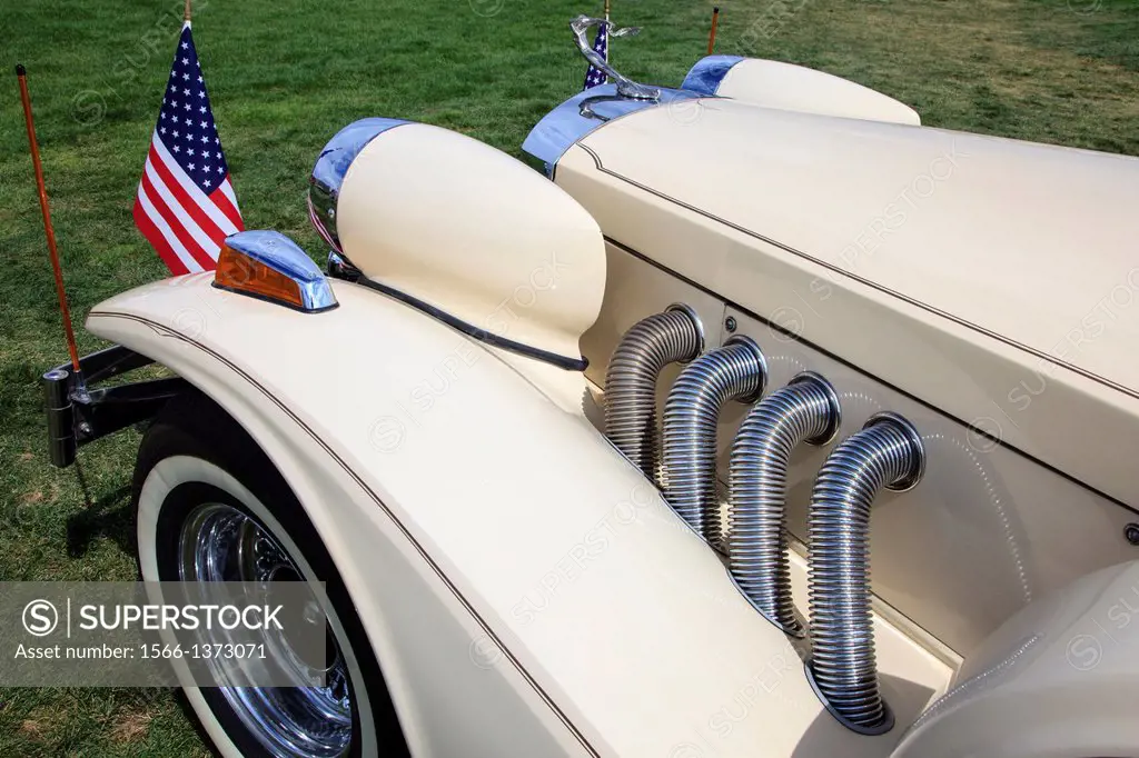 Bonnet and exhaust pipes of a 1980 Zimmer Golden Spirit 2 door American neoclassic automobile. This Zimmer was based on the 5 litre Ford Mustang.
