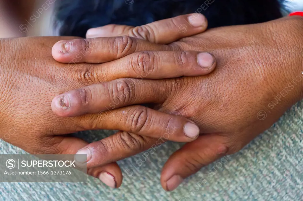 Folded Hands of a Tuk Tuk Driver in Phnom Penh, Cambodia
