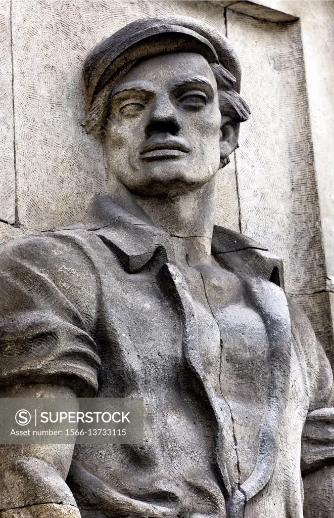 Reminders of communist era, reliefs of heroic workers. here heroic bricklayer, Marszalkowska street in Warsaw. Poland