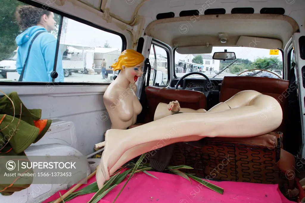 one female mannequin in the back of a car