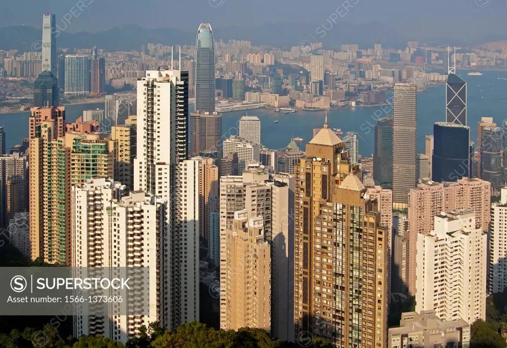 View across the skyscrapers in Central District and the Victoria Harbour to Kowloon, Hong Kong.
