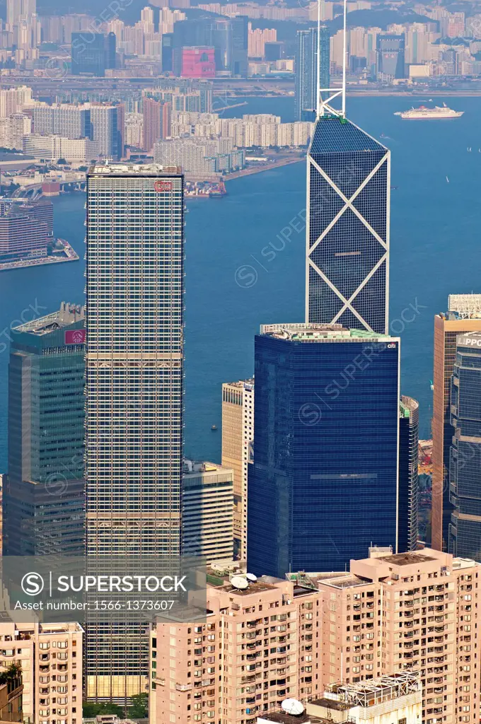 High-rising business buildings and the Bank of China Tower in the Central District against the Victoria Harbour, Hong Kong.