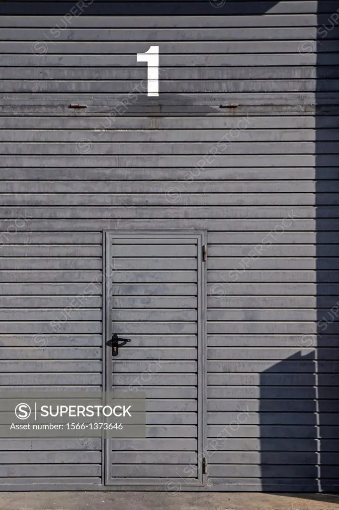 metal doors, industrial area, Baga, Catalonia, Spain