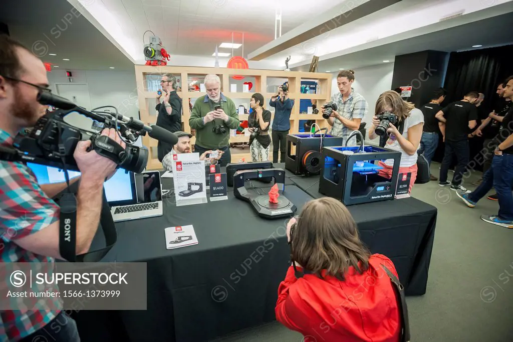 A MakerBot Industries MakerBot Digitizer Desktop 3D scanner scans a gnome figure in the MakerBot offices in New York. MakerBot introduced their $1400 ...