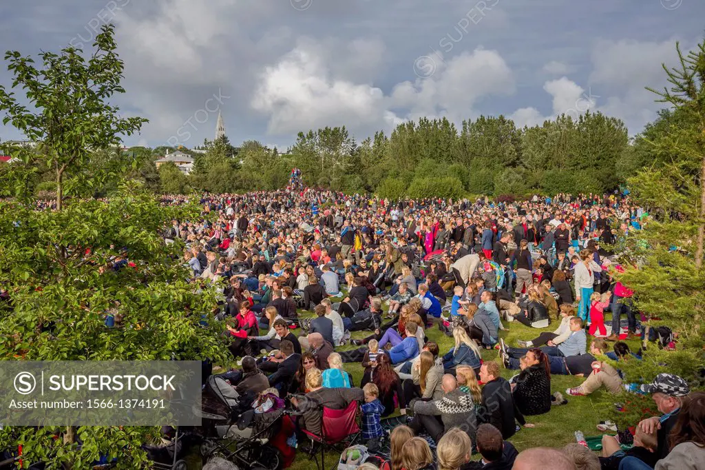 People enjoying an outdoor concert in the park. Of Monsters and Men, Reykjavik, Iceland.