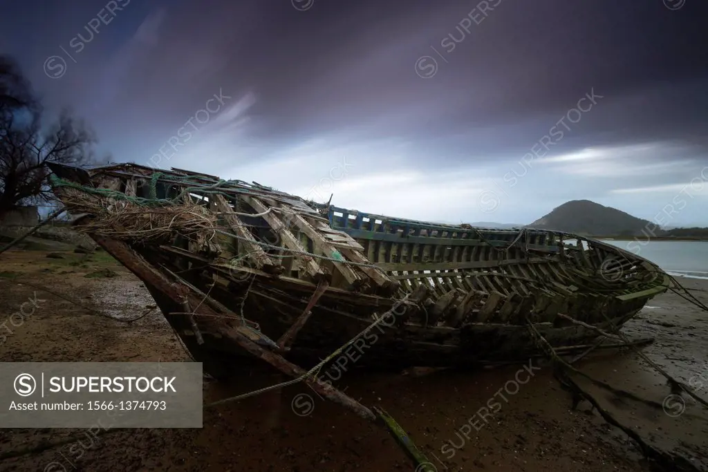 Old boats stranded in the marsh Santoña, Cantabria (Spain)