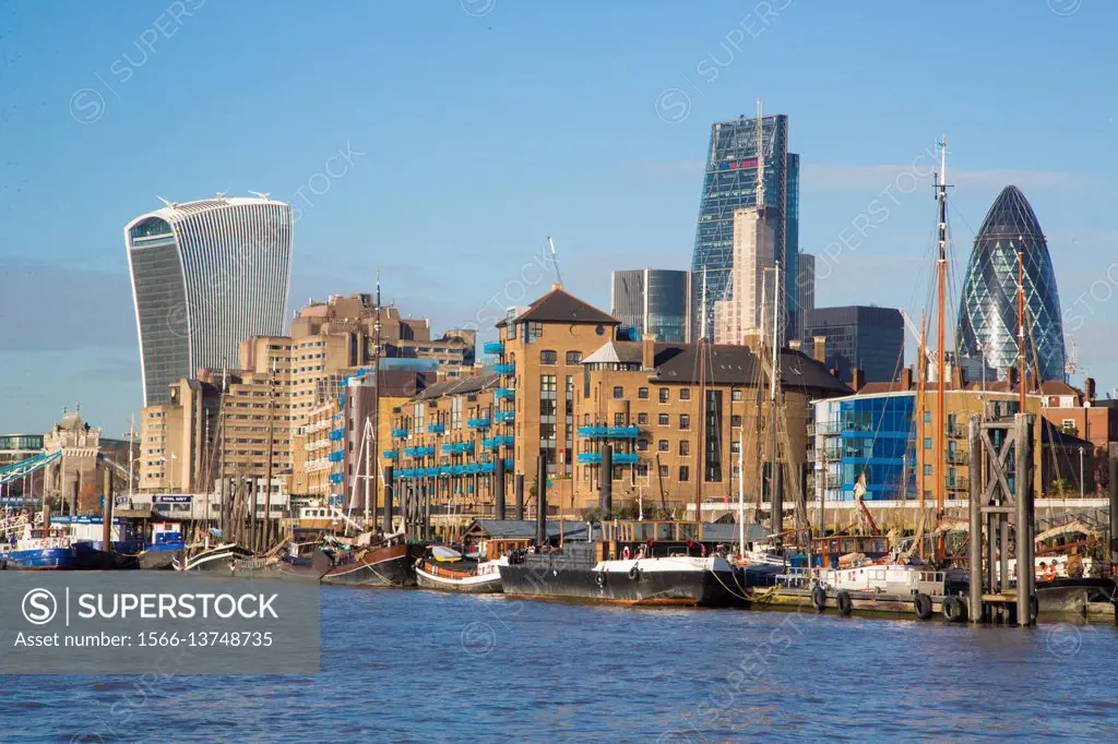 A view of London and some of the skyscrapers in the square mile and the river Thames in the foreground.