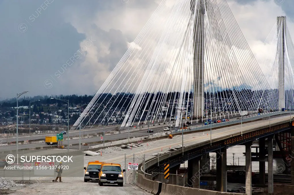 Canada, BC, Vancouver. The newly completed 10 lane, cable-stayed Port Mann Bridge behind the old structure of the same name. It crosses the Fraser Riv...