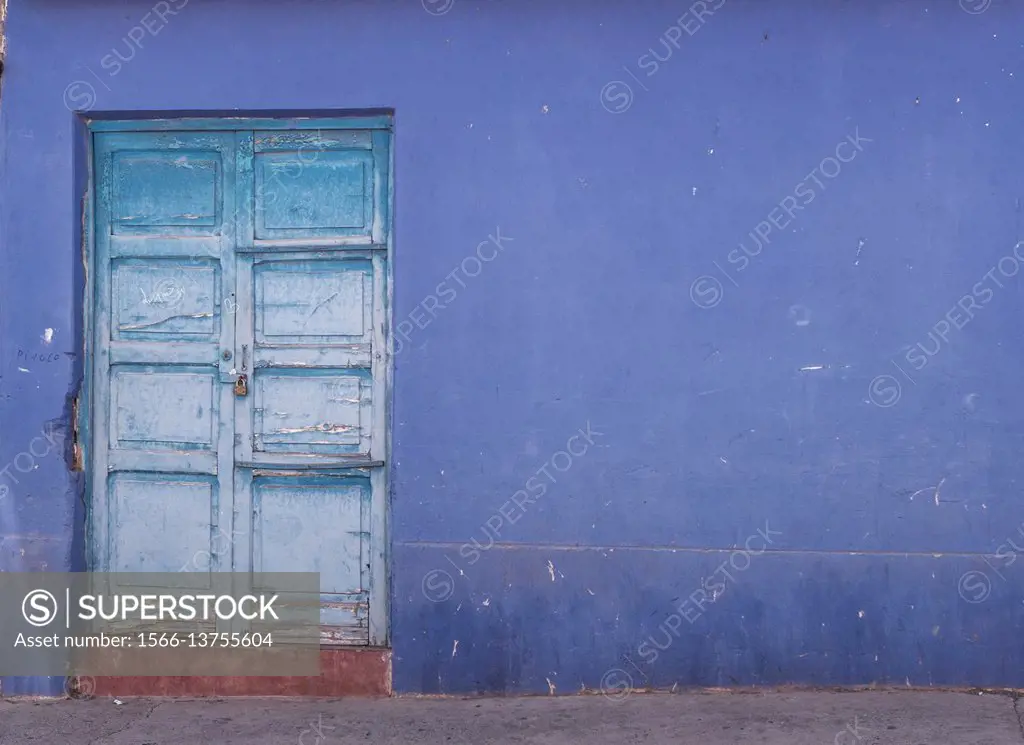 Blue door, blue wall.