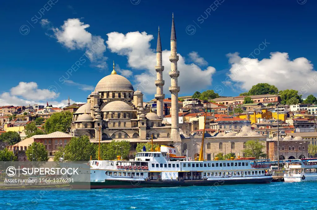 The Yeni Camii, The New Mosque or Mosque of the Valide Sultan ordered by Safiye Sultan in 1597 with a ferry on the banks of the Golden Horn, Istanbul ...