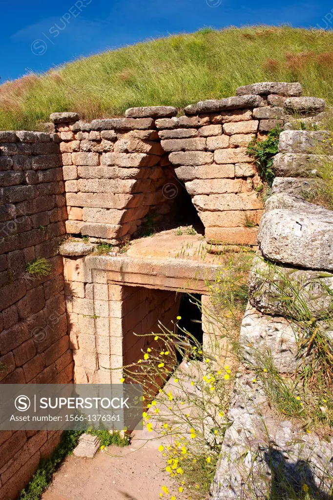Entrance to the Treasury of Atreus is an impressive ""tholos"" beehive shaped tomb on the Panagitsa Hill at Mycenae. The entrance has the typical squa...