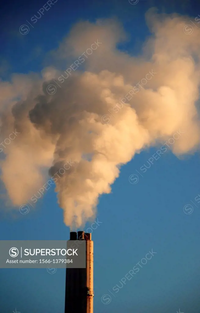 A cloud of smoke rises from a chimney