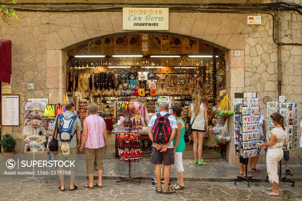 Tourists in a souvenirs shop on the streets of Valldemossa, Mallorca.