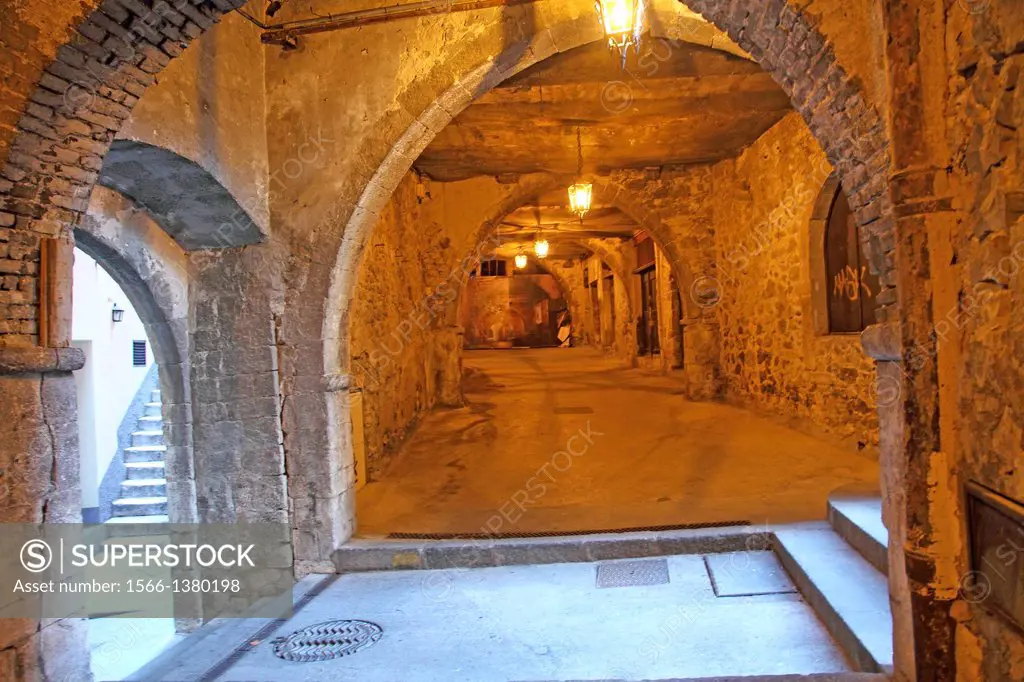 Medieval arcades in Villefrance-sur-Mer, touristic village in Cote d'Azur, France.