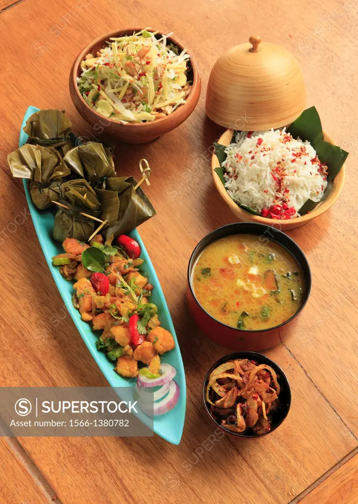 Burmese meal, fish, fish soup, salad, rice, balachaung,.