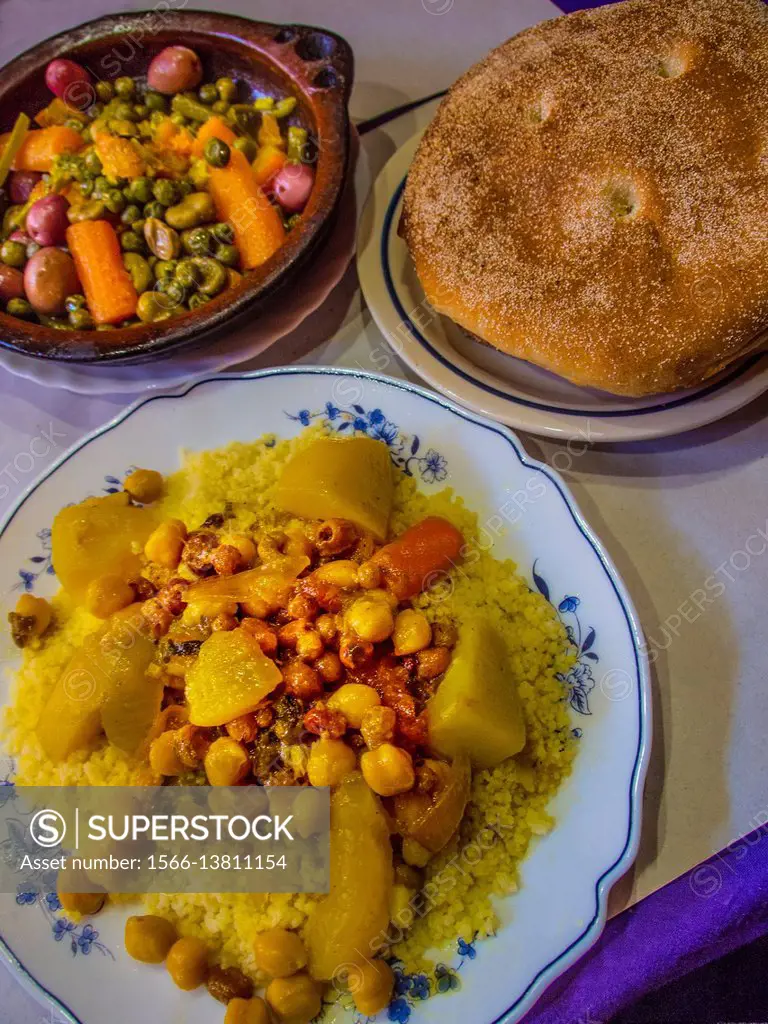 Morocco, Food, Vegetables tagine ( stew) and vegetables Couscous, with bread.