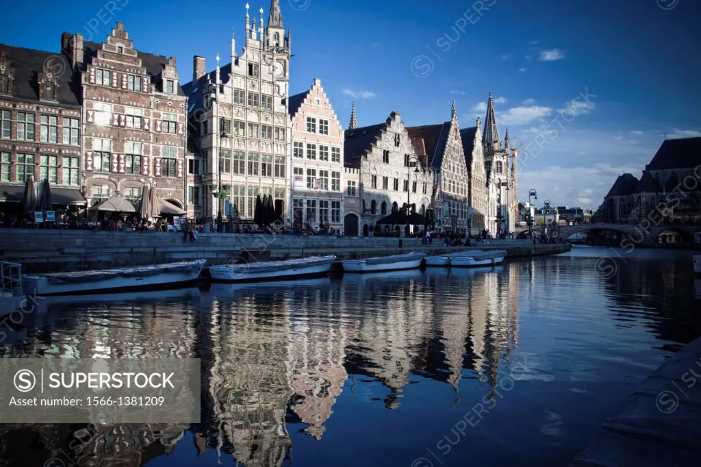 Graslei harbor attract citizens and guests to enjoy the rest on the pier and get unforgettable memories. Ghent, Belgium.