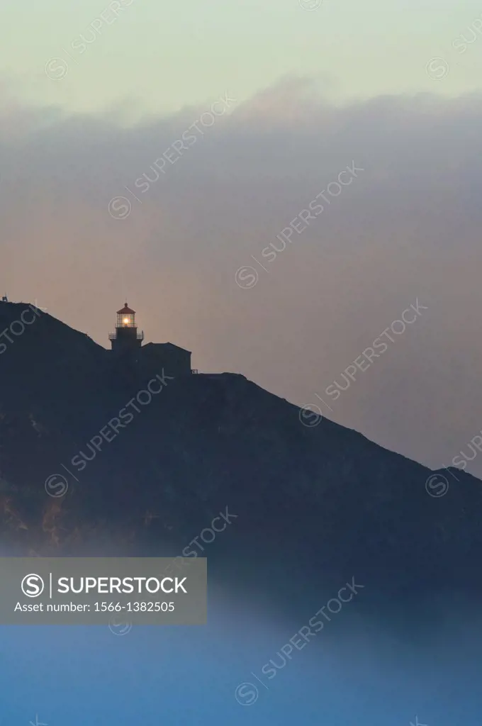 Point Sur Lighthouse and morning fog at sunrise, Big Sur, Monterey County coast, California.
