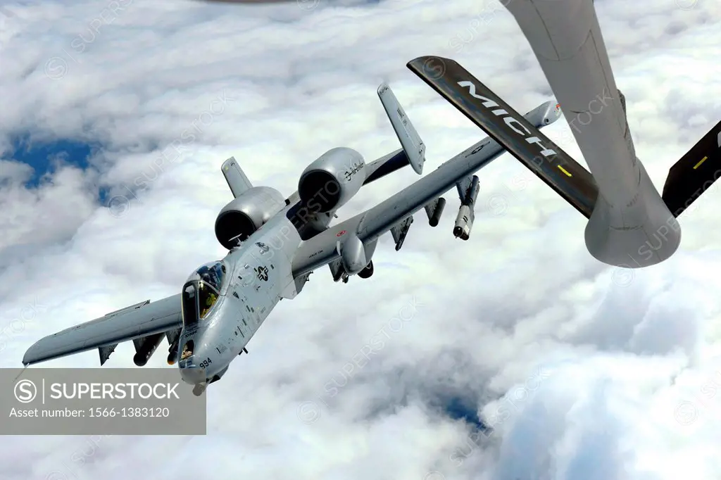 An A-10C Thunderbolt II departs after completing air-to-air refueling from a KC135 Stratotanker while over Michigan, Sept. 13, 2013. Both units are as...