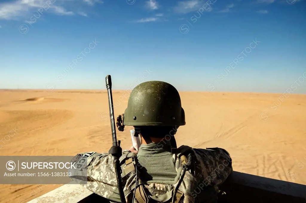 Senior Airman Justin Tamayo monitors incoming combat aircraft during a joint live-fire exercise Oct. 23, 2013, at a regional range in Southwest Asia. ...