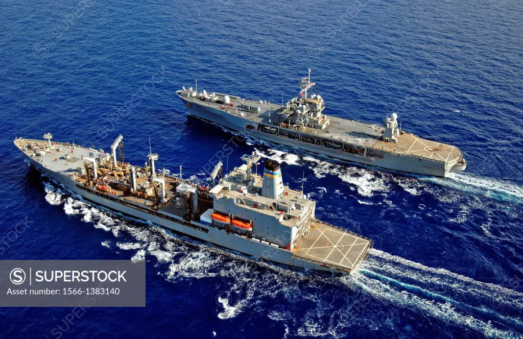 MEDITERRANEAN SEA (Oct. 28, 2013) The Military Sealift Command fleet replenishment oiler USNS Leroy Grumman (T-AO 195), bottom, conducts a replenishme...