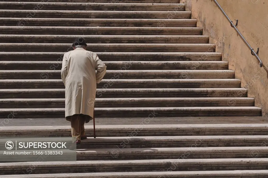 Roma, Italy, an aged man walking along a staircase in Piazza del Campidoglio