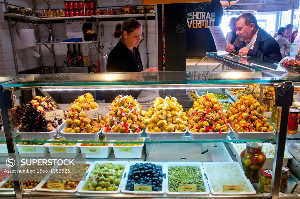 Assorted appetizers with olives. San Miguel market, Madrid, Spain.