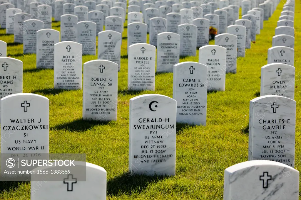 Holly, Michigan - The Islamic star and crescent symbol on a tombstone at the Great Lakes National Cemetery, surrounded by grave markers showing the Ch...