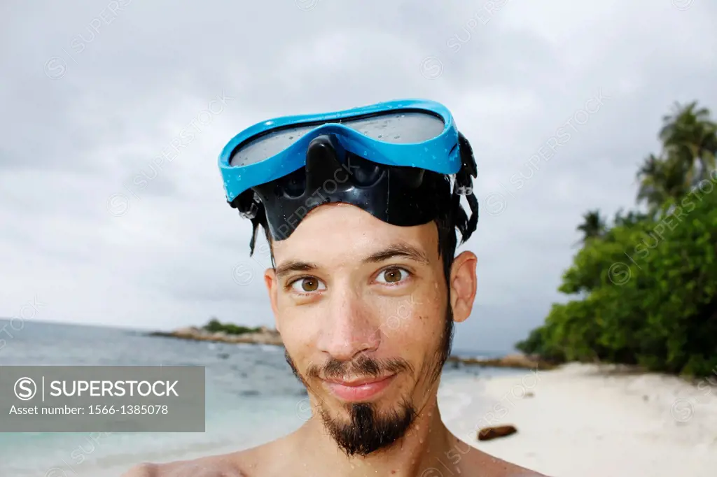 Self-portrait of a man with a diving mask, Island Pulau Perhentian Kecil, China sea, Terengganu, Malaysia.
