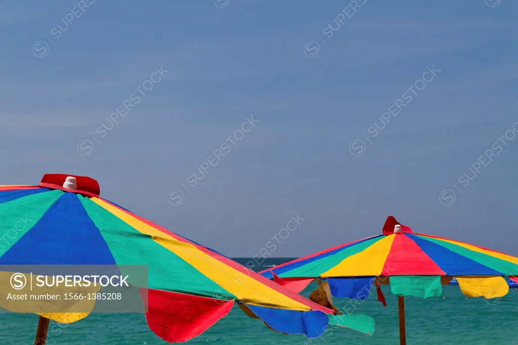 Colorful Sun Shades at Mai Khao Beach on Phuket, Thailand.