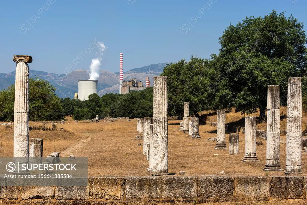 Columns from the ruins of Ancient Megalopolis with the cooling tower and chimney of Mergalopoli's modern power station in the background. Central Pelo...