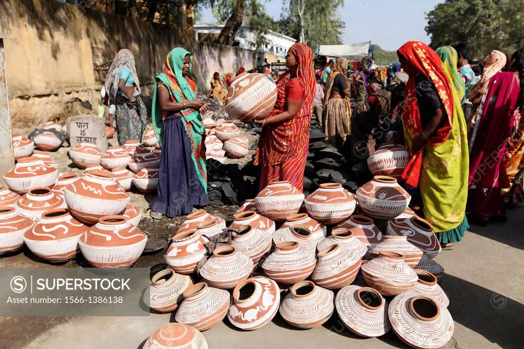 Tribal woman selling pots, Jhabua, Madhya Pradesh, India.