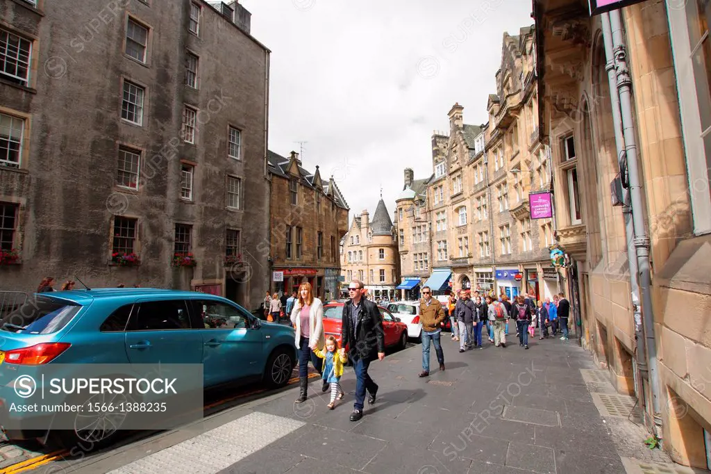 Streets of the Old Town with old, historic architecture and tourists walking in Edinburgh, Scotland, Great Britain, UK, Europe
