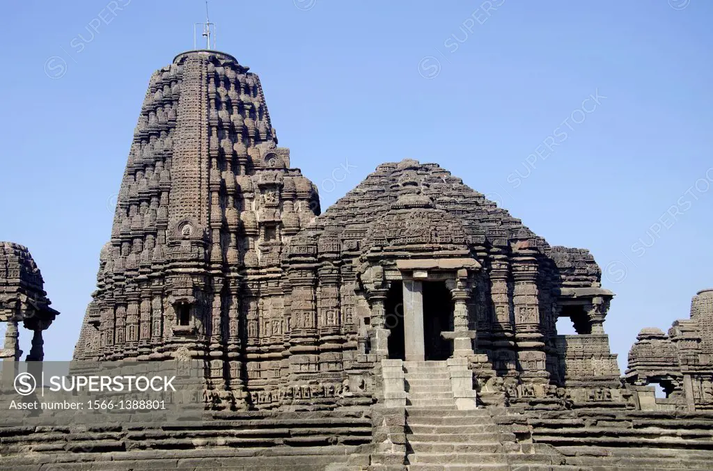 Gondeshwar Temple, It is built on a vast area and consists of numerous shrines built in an architectural style called Hemadpanthi style. Black stone a...