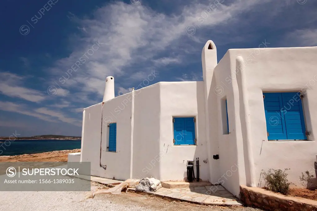 Whitewashed houses with traditional Cyclades architecture by the sea, Naoussa, Paros, Cyclades Islands, Greek Islands, Greece, Europe.