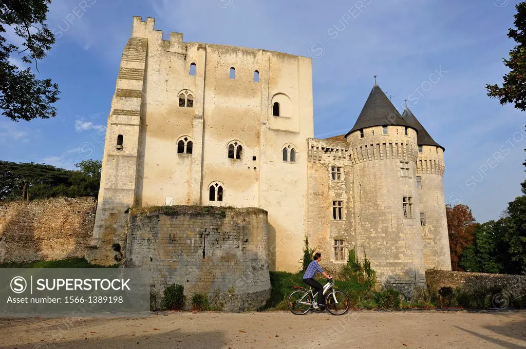 young woman cycling in front of the Castle St-Jean, Nogent-le-Rotrou, Parc naturel regional du Perche, Eure & Loir department, region Centre, France, ...