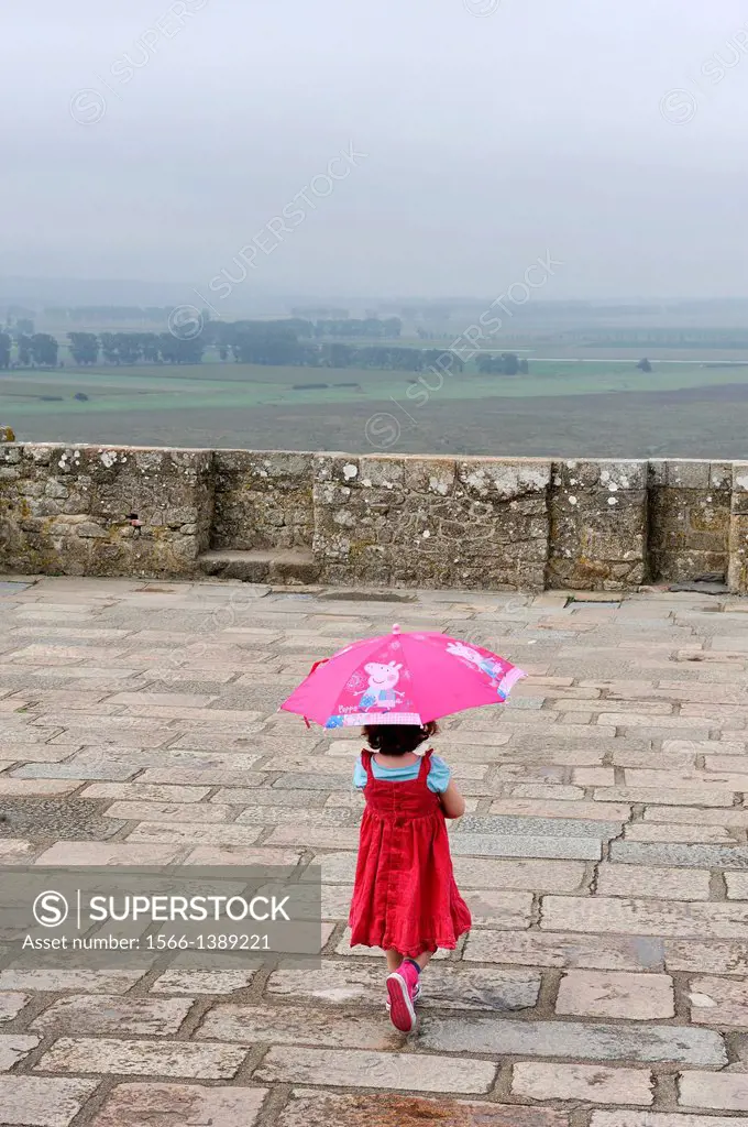 little girl on the square of the church-abbey, Mont Saint-Michel Abbey, Manche department, Low Normandy region, France, Europe.