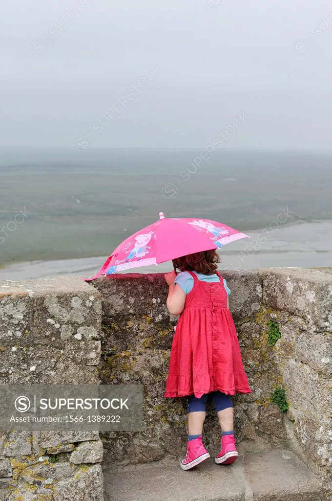 little girl on the square of the church-abbey, Mont Saint-Michel Abbey, Manche department, Low Normandy region, France, Europe.