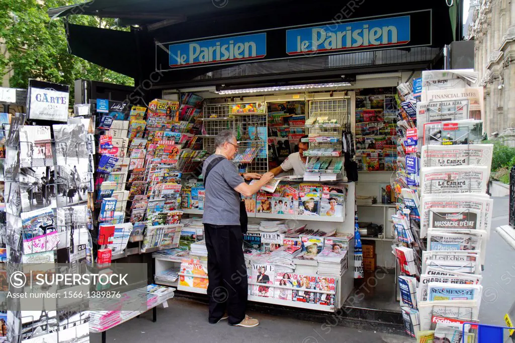 France, Europe, French, Paris, 4th arrondissement, Rue de Rivoli, newsstand, newspapers, magazines, sale,.
