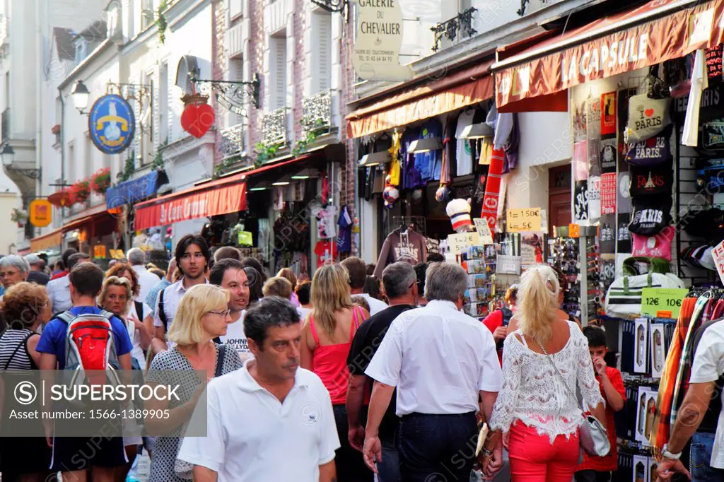 France, Europe, French, Paris, 18th arrondissement, Montmatre, Rue Saint-Rustique, Place du Tertre, man, woman, couple, shopping, souvenir shops, sale...