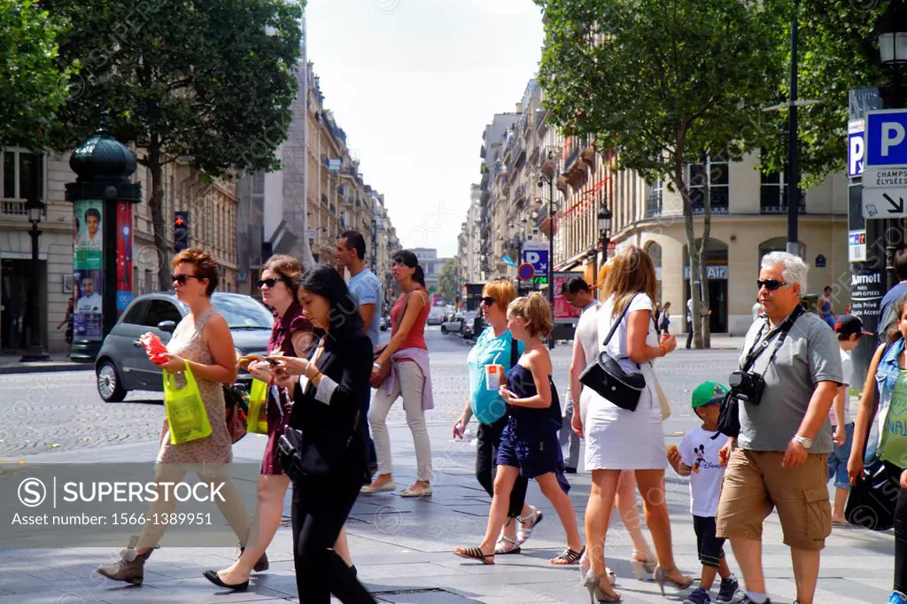 France, Europe, French, Paris, 8th arrondissement, Avenue des Champs Élysées, pedestrians, street, woman, man, Asian, crossing,.
