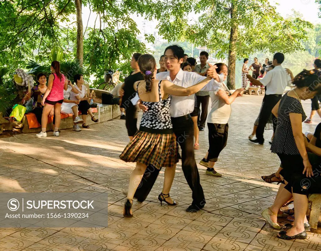 ballroom dancing at Hoan Kiem Lake in Hanoi, Vietnam.